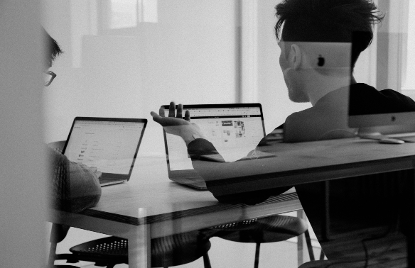 A man using a mackbook to check analytics in the assisted and senior living industries