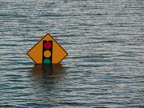 Traffic sign under water in a flood disaster